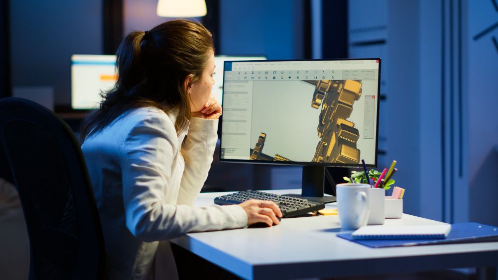 A girl developing mechanics equipment on computer.