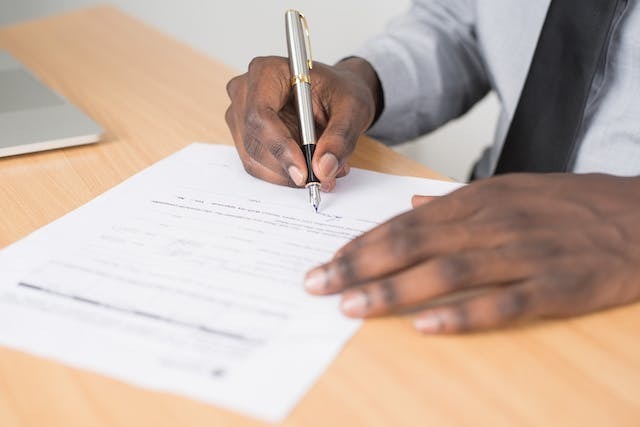 A man writing a Motivation Letter for Universities of Germany